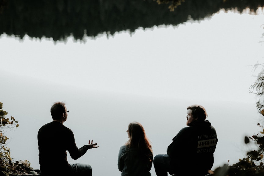Friends in conversation outside The Church and the faithful cannot stay silent about the gender identity rebellion against male and female. We must speak out.